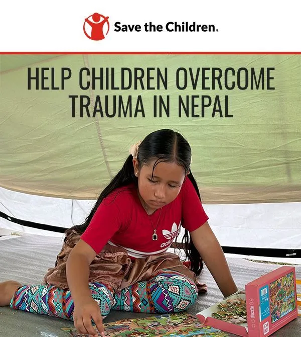 Child assembling a puzzle with the help of a Save the Children program in Nepal